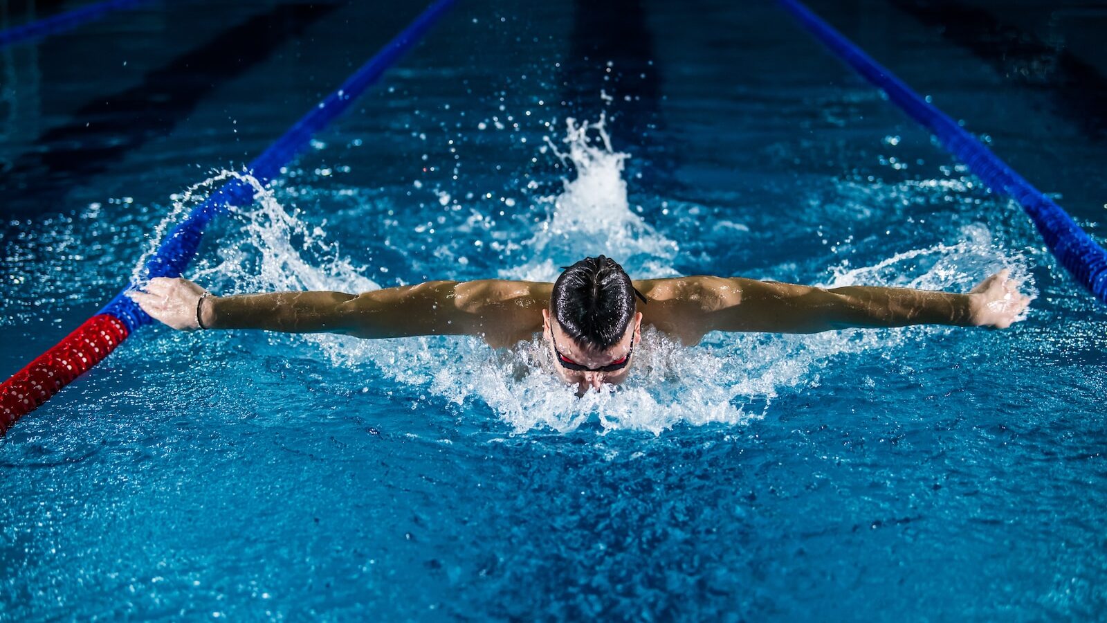 man doing butterfly stroke