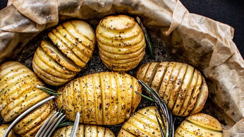 forks on steamed and sliced potatoes