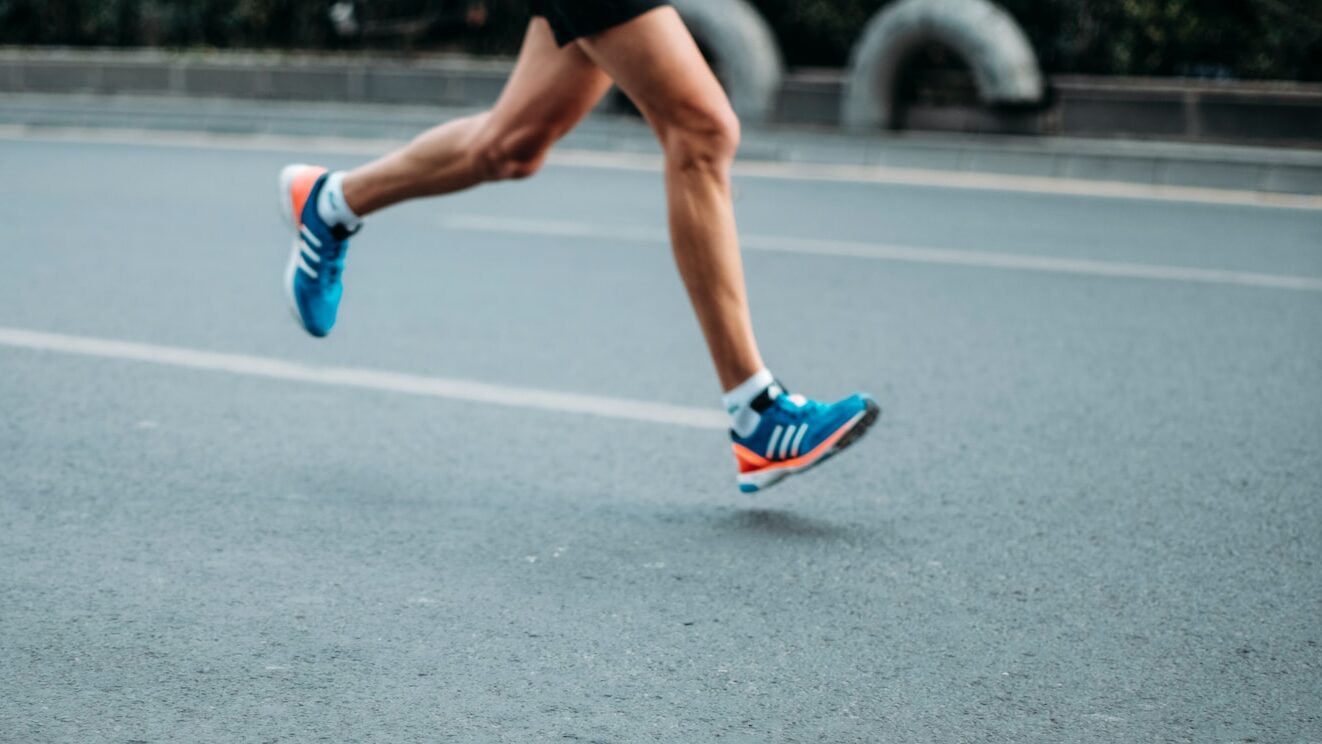 pair of blue-and-white Adidas running shoes