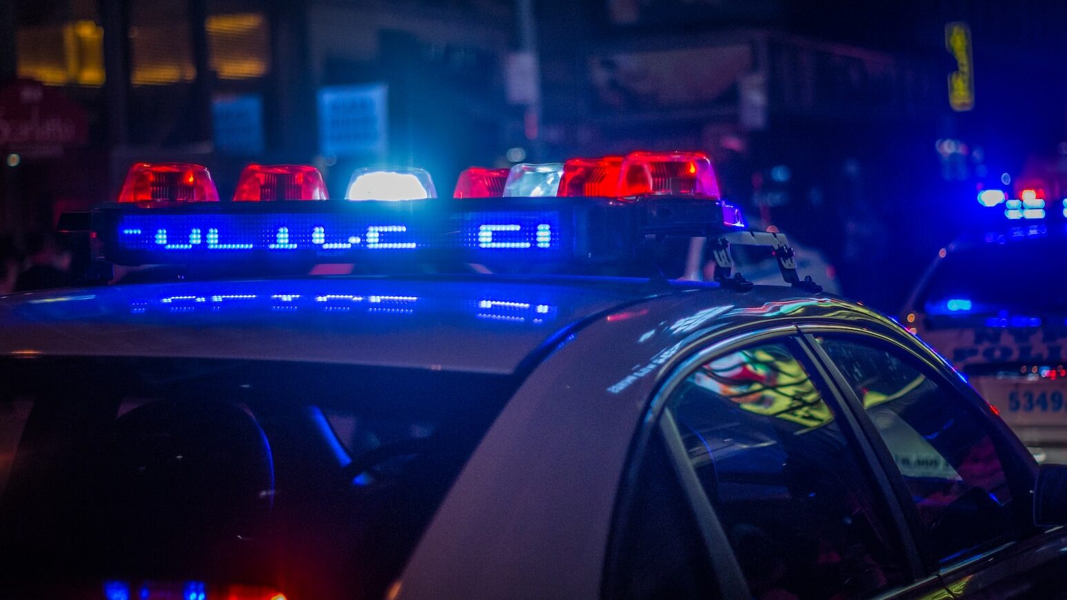 blue car on the street during night time